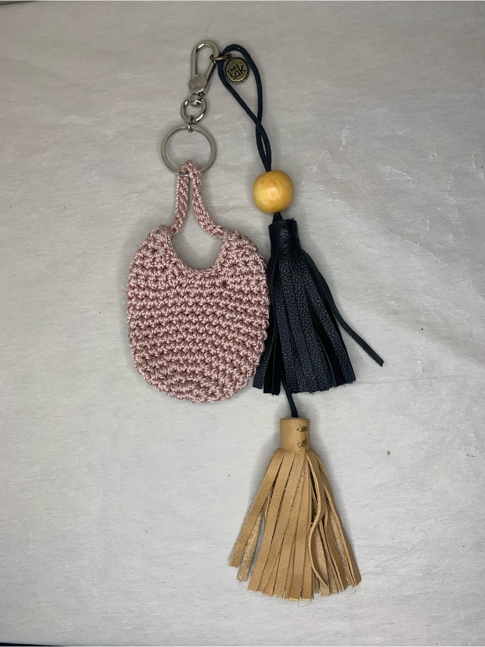 The Sak Pink Crochet Key & Card Holder with Black and Tan Tassels